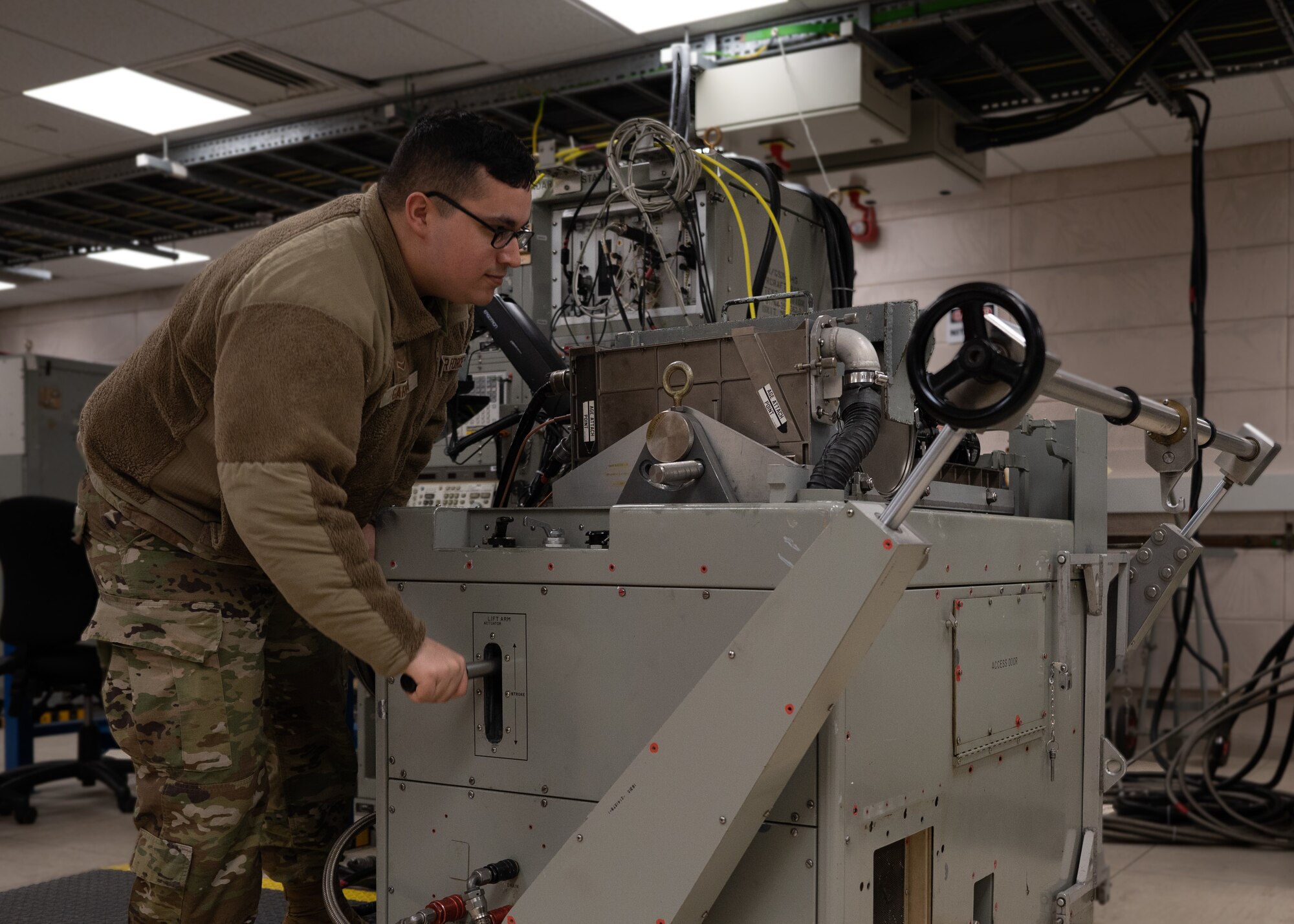 U.S. Air Force Airman 1st Class Alexander Garcia, 48th Component Maintenance Squadron Enhanced Aircraft Radar Test Station technician, performs final checks on the 111-Transmitter.