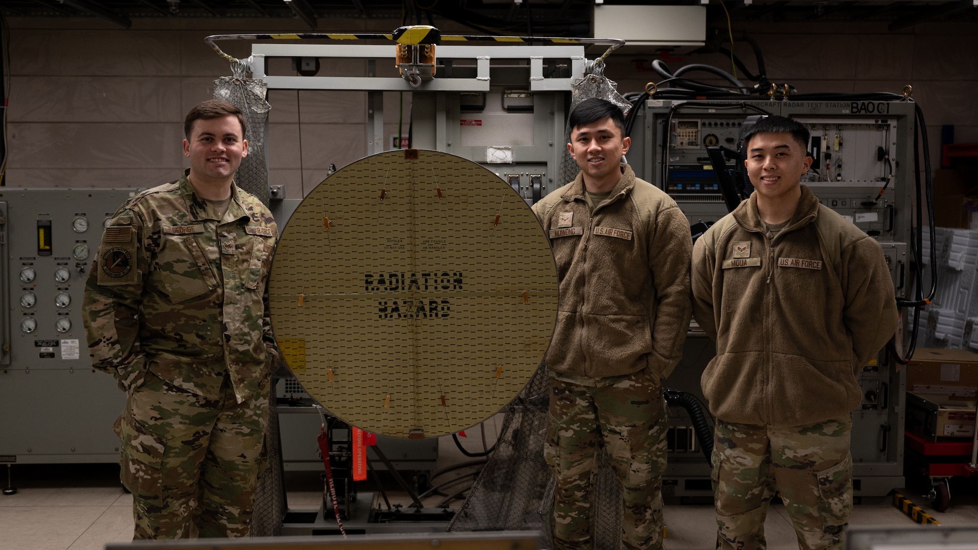 Airmen pose for photo with Enhanced Aircraft Radar Test Station.