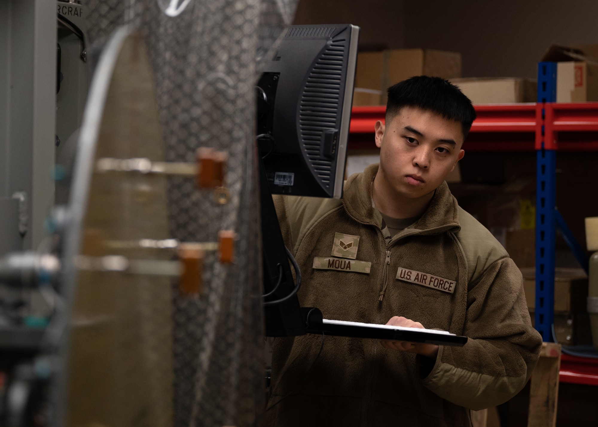 An Airmen performs checks on a Radar test station.