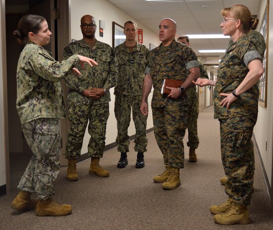 Explaining at lot of this and more of that… Lt. Cmdr. Trinity Dunham, Mental Health department division officer shares NHB/NMRTC Bremerton’s Mental Health commitment to patients and outreach emphasis to an impressed U.S. Navy Rear Adm. Pamela Miller, medical officer of the Marine Corps during her familiarization visit and tour of the command, April 4, 2024. Dunham explained about the wide array of outpatient behavioral health services such as individual psychotherapy, operational and readiness-related psychological evaluations to Sailors, Marines and Coast Guard across approximately 300 tenet commands in the Pacific Northwest and as far afield as Naval Air Station Lemoore (Official Navy photo by Douglas H Stutz, NHB/NMRTC Bremerton public affairs officer).