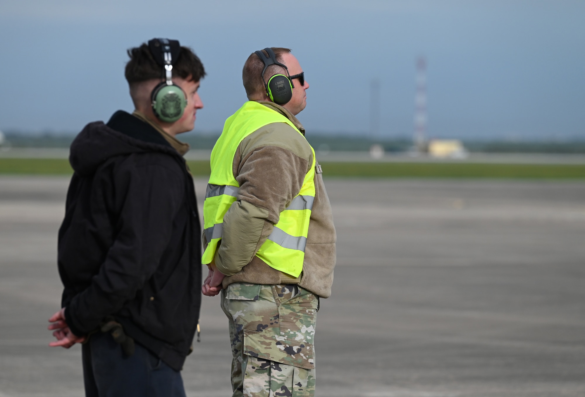 Airman 1st Class Andrew Graf, 9th Expeditionary Bomb Squadron crew chief, and Chief Master Sgt. Justin Daigle, 9th EBS Maintenance Senior Enlisted Leader, wait to marshall out a B-1B Lancer during Bomber Task Force 24-2 at Morón Air Base, Spain, April 2, 2024. The rotational deployment of U.S. bomber forces in Europe is evidence of the enduring commitment to NATO Allies and to a whole, free and peaceful Europe. U.S. forces are ready, postured and well-prepared to integrate with host-nation Allies and partners to deter threats and defend the Alliance. (U.S. Air Force photo by Staff Sgt. Holly Cook)