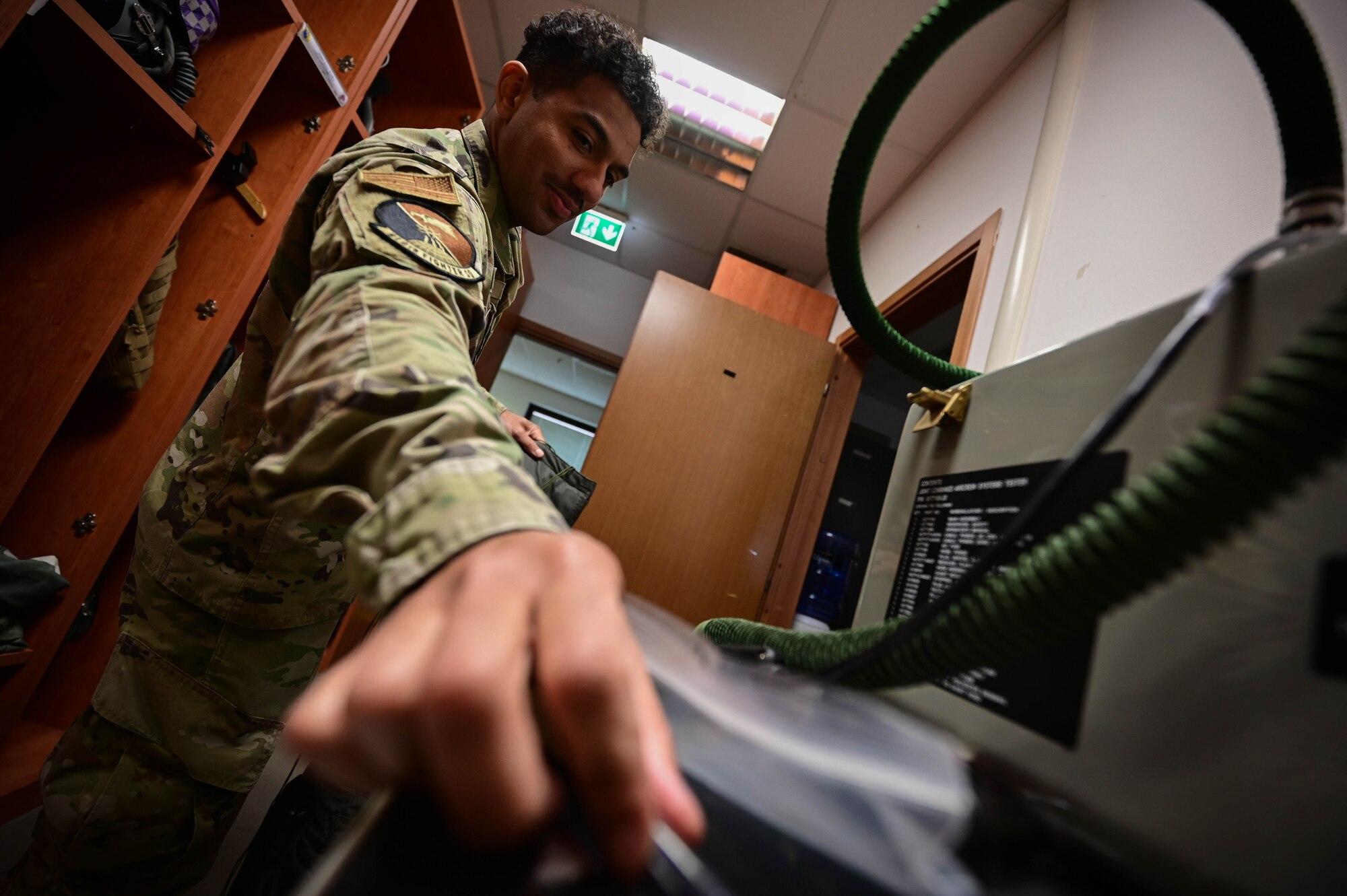 An Airman tests a flight suit.