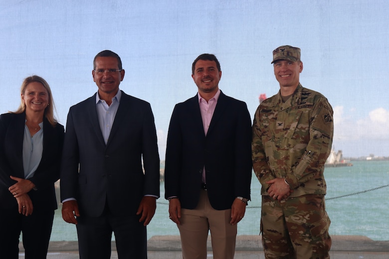 TF-VIPR Commander Col. Charles L. Decker, Puerto Rico Governor, Pedro Pierluisi, USACE TF-VIPR Deputy for Programs & Project Management, Jacqueline Keiser, PG, PMP, and Puerto Rico Ports Authority Executive Director, Joel Pizá standing with the ocean in the background.