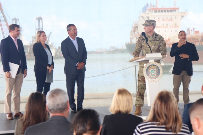 Col. Charles Decker in uniform at a podium