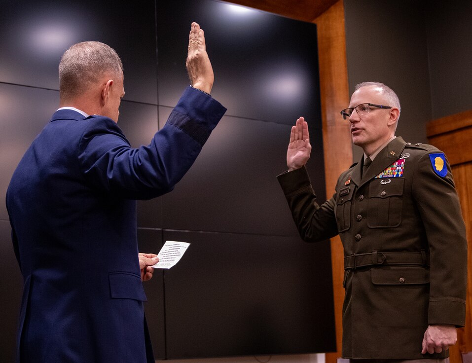 Newly promoted U.S. Army Brig. Gen. Michael Eastridge, of Plymouth, Michigan, Deputy Assistant Adjutant General, Illinois Army National Guard, is administered the oath of office during a promotion ceremony April 6 at the Illinois Military Academy, Camp Lincoln, Springfield, Illinois.