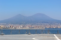 240407-N-JC445-1003 NAPLES, Italy (April 7, 2024) A photo of Mount Vesuvius as the Blue Ridge-class command and control ship USS Mount Whitney (LCC 20) arrives in Naples, Italy. Mount Whitney, the U.S. Sixth Fleet flagship, is on a scheduled port visit to participate in the 75th anniversary of the NATO Alliance and enhance U.S.-Italian relations. Homeported in Gaeta, Mount Whitney operates with a combined crew of U.S. Sailors and Military Sealift Command civil service members. (U.S. Navy photo by Mass Communication Specialist 2nd Class Mario Coto)