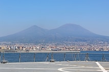 240407-N-JC445-1003 NAPLES, Italy (April 7, 2024) A photo of Mount Vesuvius as the Blue Ridge-class command and control ship USS Mount Whitney (LCC 20) arrives in Naples, Italy. Mount Whitney, the U.S. Sixth Fleet flagship, is on a scheduled port visit to participate in the 75th anniversary of the NATO Alliance and enhance U.S.-Italian relations. Homeported in Gaeta, Mount Whitney operates with a combined crew of U.S. Sailors and Military Sealift Command civil service members. (U.S. Navy photo by Mass Communication Specialist 2nd Class Mario Coto)