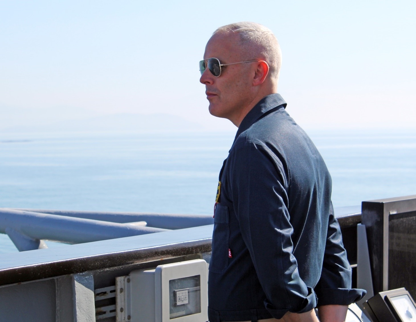 240407-N-JC445-1001 NAPLES, Italy (April 7, 2024) Capt. Matthew Kiser, commanding officer, observes sea and anchor detail aboard the Blue Ridge-class command and control ship USS Mount Whitney (LCC 20) as it arrives in Naples, Italy. Mount Whitney, the U.S. Sixth Fleet flagship, is on a scheduled port visit to participate in the 75th anniversary of the NATO Alliance and enhance U.S.-Italian relations. Homeported in Gaeta, Mount Whitney operates with a combined crew of U.S. Sailors and Military Sealift Command civil service members. (U.S. Navy photo by Mass Communication Specialist 2nd Class Mario Coto)