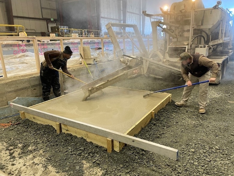 Researchers spread concrete during a full-scale placement conducted at ERDC’s Cold Regions Research Engineering Laboratory (CRREL) Frost Effects Research Facility. Team members from CRREL and ERDC’s Geotechnical and Structures Laboratory collaborated to conduct several full-scale placements of JetCon JC400 rapid-setting concrete as a part of the Office of the Under Secretary of Defense for Research and Engineering’s Foreign Comparative Testing program.
