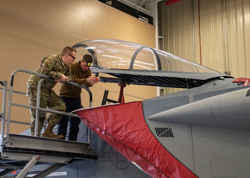 Staff Sgt. Colby Ballou and Staff Sgt. Alec Halbrook, 104th Maintenance Group flightline avionics technicians, perform wire repairs for a time compliance technical order, February 29, 2024, at Barnes Air National Guard Base, Massachusetts. Ballou is one of 21 Airmen from the 104th Fighter Wing selected for the Wing's core cadre program which sends Airmen to active duty F-35 bases for two years to train and learn the aircraft in preparation for the 104FW's conversion.  (U.S. Air National Guard photo by Tech. Sgt. Sara Kolinski)