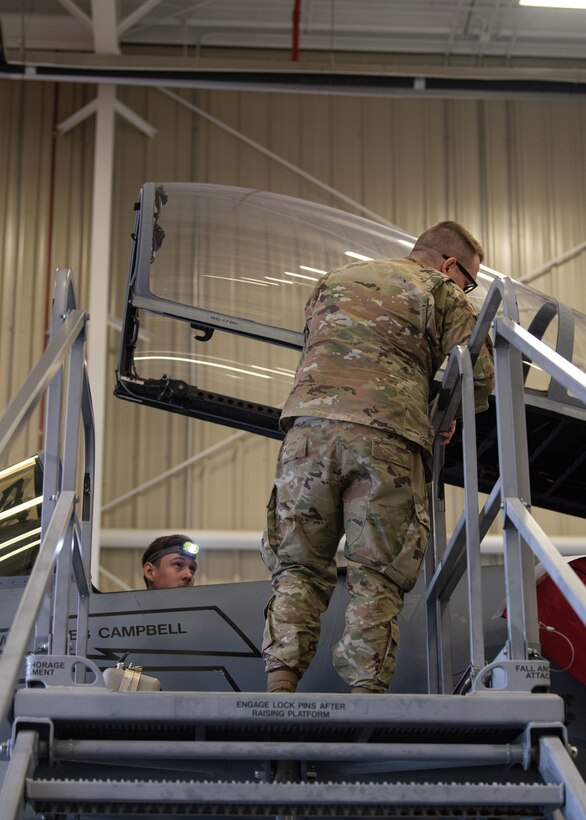 Staff Sgt. Colby Ballou and Staff Sgt. Alec Halbrook, 104th Maintenance Group flightline avionics technicians, perform wire repairs for a time compliance technical order, February 29, 2024, at Barnes Air National Guard Base, Massachusetts. Ballou is one of 21 Airmen from the 104th Fighter Wing selected for the Wing's core cadre program which sends Airmen to active duty F-35 bases for two years to train and learn the aircraft in preparation for the 104FW's conversion.  (U.S. Air National Guard photo by Tech. Sgt. Sara Kolinski)