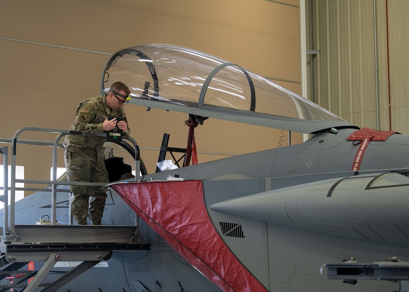 Staff Sgt. Colby Ballou, 104th Maintenance Group flightline avionics technician, looks over wire schematics for a time compliance technical order, February 29, 2024, at Barnes Air National Guard Base, Massachusetts. Ballou is one of 21 Airmen from the 104th Fighter Wing selected for the Wing's core cadre program which sends Airmen to active duty F-35 bases for two years to train and learn the aircraft in preparation for the 104FW's conversion.  (U.S. Air National Guard photo by Tech. Sgt. Sara Kolinski)