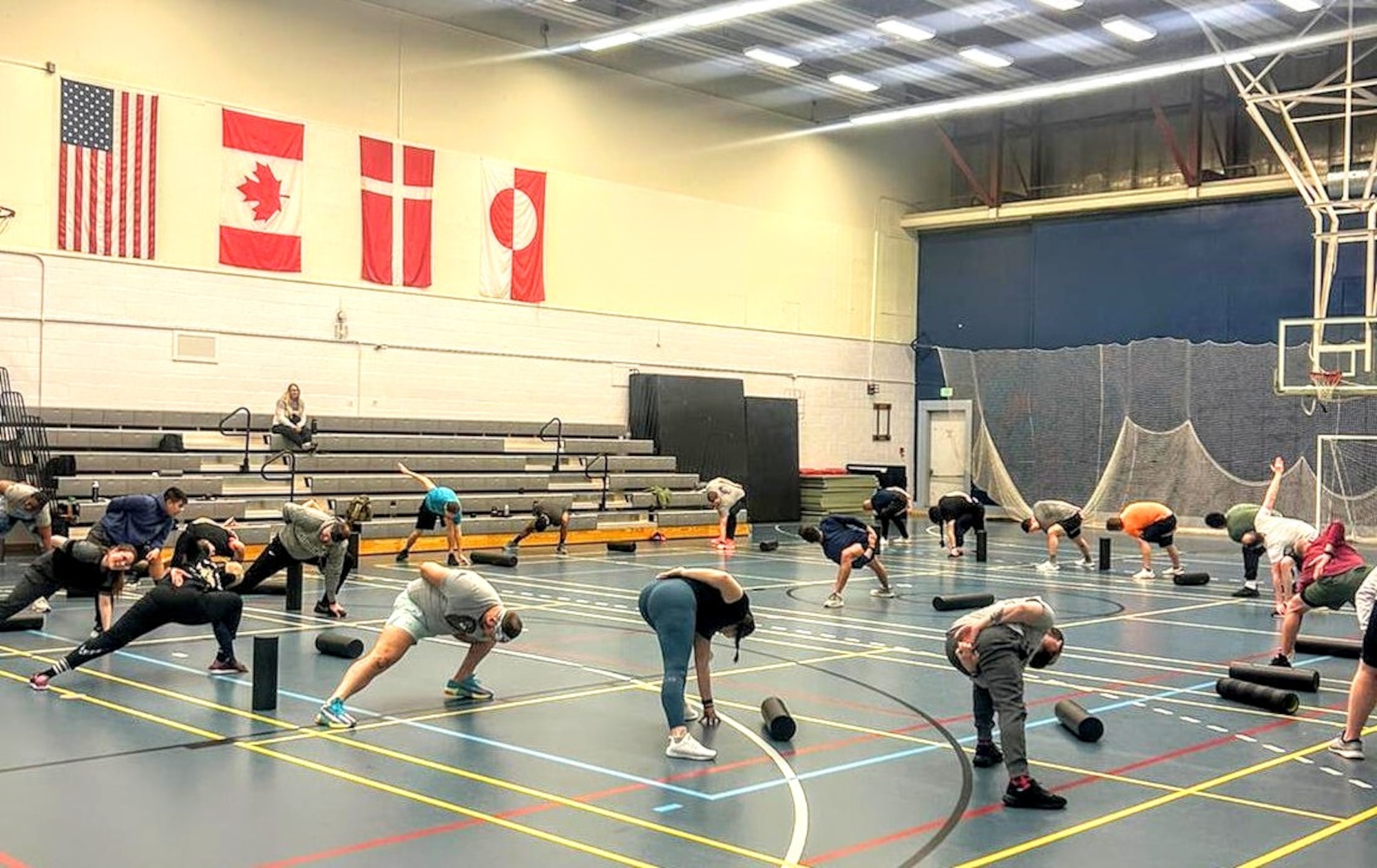 Servicemembers from the 821st Space Base Group complete stretches with the Schriever Space Force Base’s Operational Support Team during their recent visit to Pituffik Space Base, Greenland, March 18, 2024. The purpose of the visit was to increase servicemembers’ understanding of the impact their environment plays on their physical health while providing them with the tools to combat these daily stressors in order to optimize their performance and prevent potential injuries. (Courtesy photo provided by U.S. Air Force Maj. Sean Batzer)