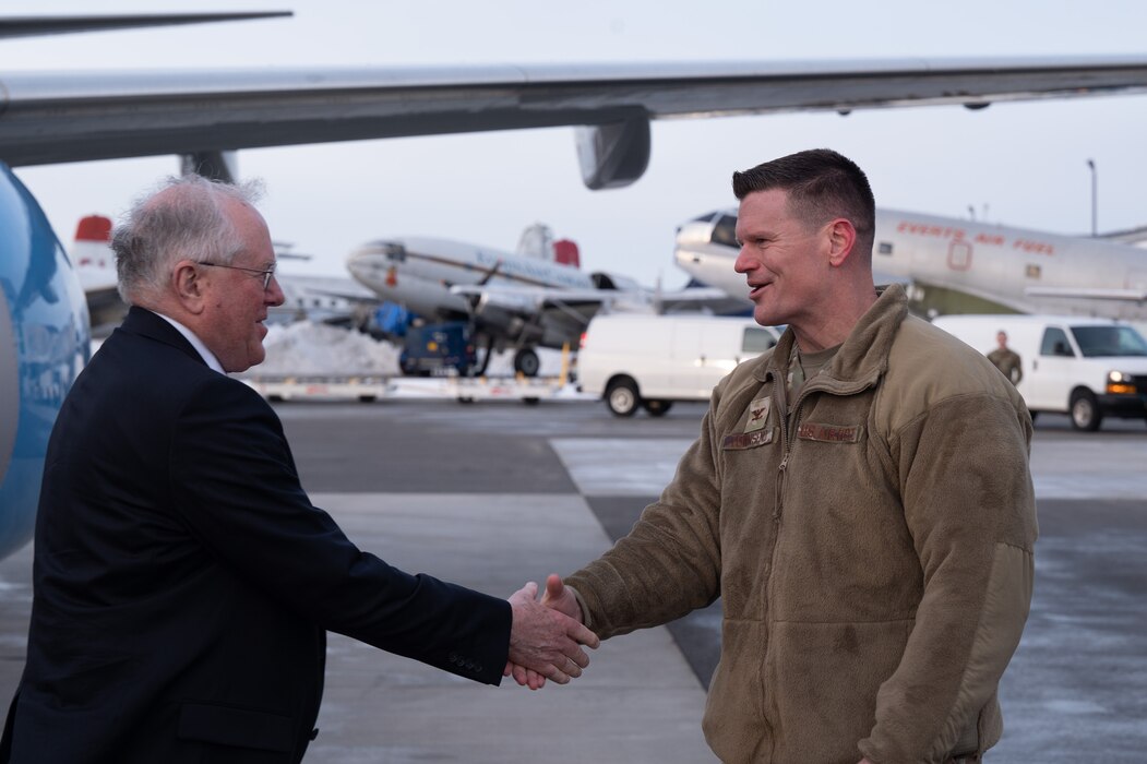 U.S. Air Force Col. Paul Townsend, 354th Fighter Wing commander, shakes hands with Secretary of the Air Force Frank Kendall after he arrives at the Fairbanks International Airport