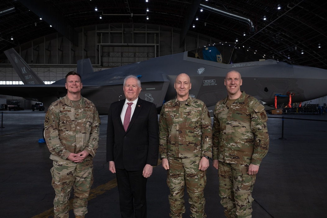 Secretary of the Air Force Frank Kendall and U.S. Air Force Chief of Staff Gen. David Allvin pose with Col. Paul Townsend, 354th Fighter Wing commander, and Chief Master Sgt. Sean Milligan, 354th FW command chief in front of an F-35A Lightning II aircraft.
