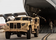 Soldiers with the 5th Squadron, 7th Cavalry Regiment, 1st Armored Brigade Combat Team (5-7 CAV), 3rd Infantry Division (3ID) load an armored vehicle into C-17 and C-5 aircraft at Hunter Army Airfield, Savannah, Georgia, Apr. 2, 2024.