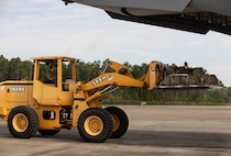 Soldiers, assigned to the 5th Squadron, 7th Cavalry Regiment, 1st Armored Brigade Combat Team (5-7 CAV), 3rd Infantry Division (3ID), load combat gear with Airmen into C-17 and C-5 aircraft at Hunter Army Airfield, Savannah, Georgia, Apr. 2, 2024.