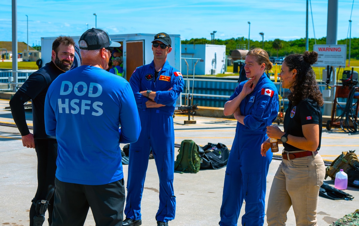 Cape Canaveral SFS, April 2024 - A multinational team of rescue specialists, including three members from the Royal Canadian Air Force Search and Rescue along with Pararescue Specialist from the 38th Rescue Squadron from Moody AFB, Ga., underwent rigorous training at the Rescue Force Qualification Course taught by 1 AF, Det 3 Rescue Instructor Cadre. The course prepares rescue forces for alert posturing through comprehensive academics, ground, and water operations. Trainees are immersed in space medicine basics and trained on a practice spacecraft analogue for crew capsule functionalities, astronaut extrication techniques, and spacecraft hazard identification, culminating in capsule up-righting drills. This collaboration, requested by NASA, aims to broaden rescue capabilities for Commercial Crew Program launches and foster a closer bond between Det 3/SOC and the Joint Rescue Coordination Centre, streamlining communication for global rescue missions.