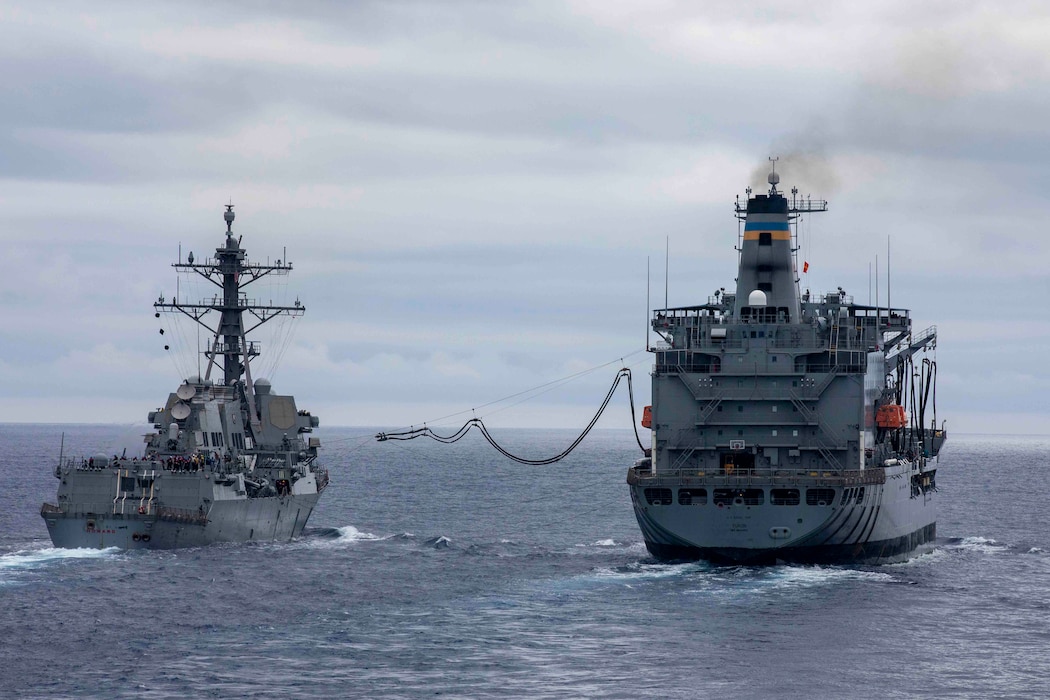 USS Howard (DDG 83) conducts a replenishment-at-sea with USNS Yukon (T-AO 202) in the Philippine Sea.