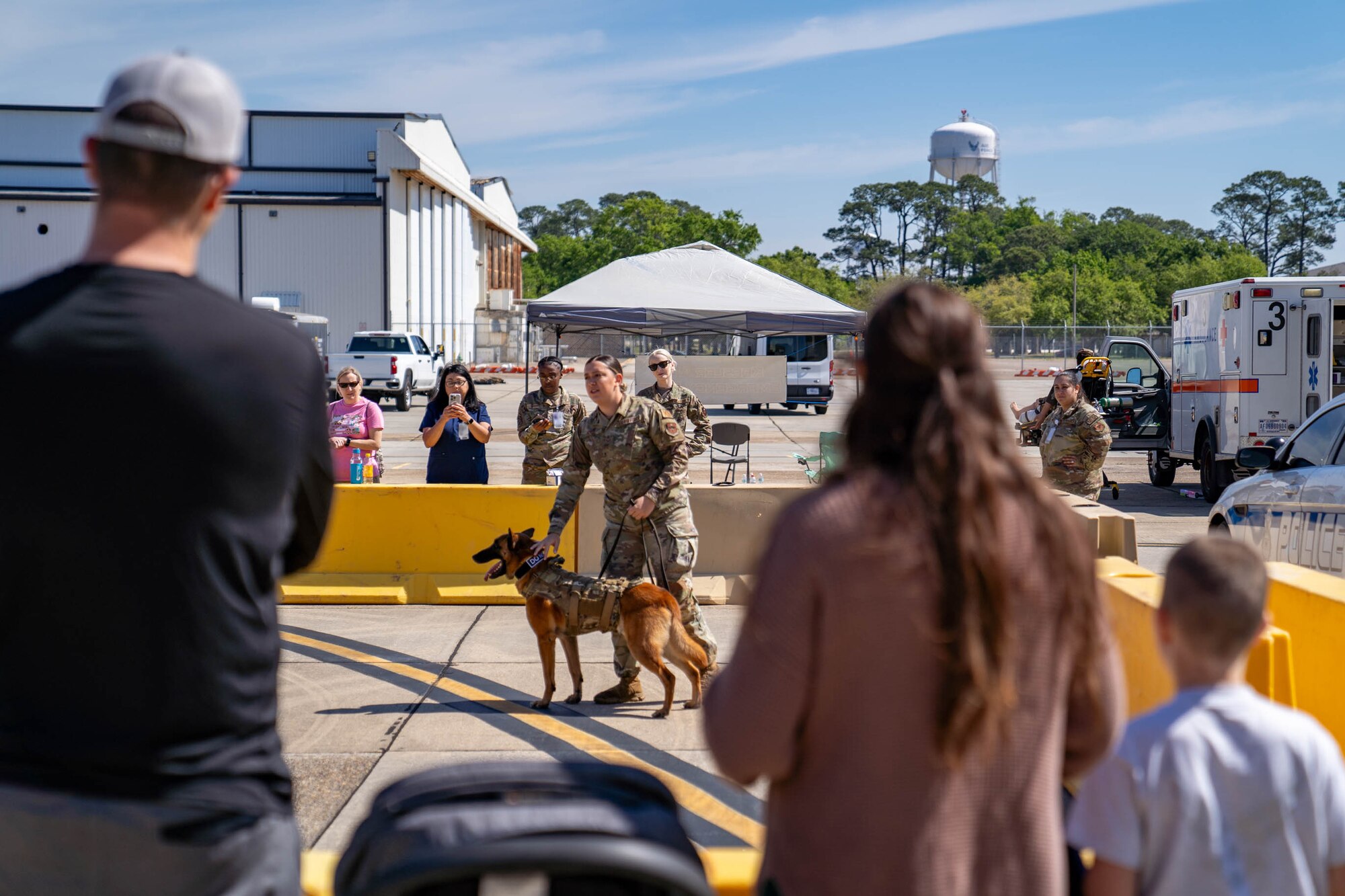 U.S. Air Force Staff Sgt. Ryan Wood, 81st Security Forces Squadron military working dog handler, works with MWD Victor for a demonstration at Operation HERO at Keesler Air Force Base, Mississippi, April 6, 2024.