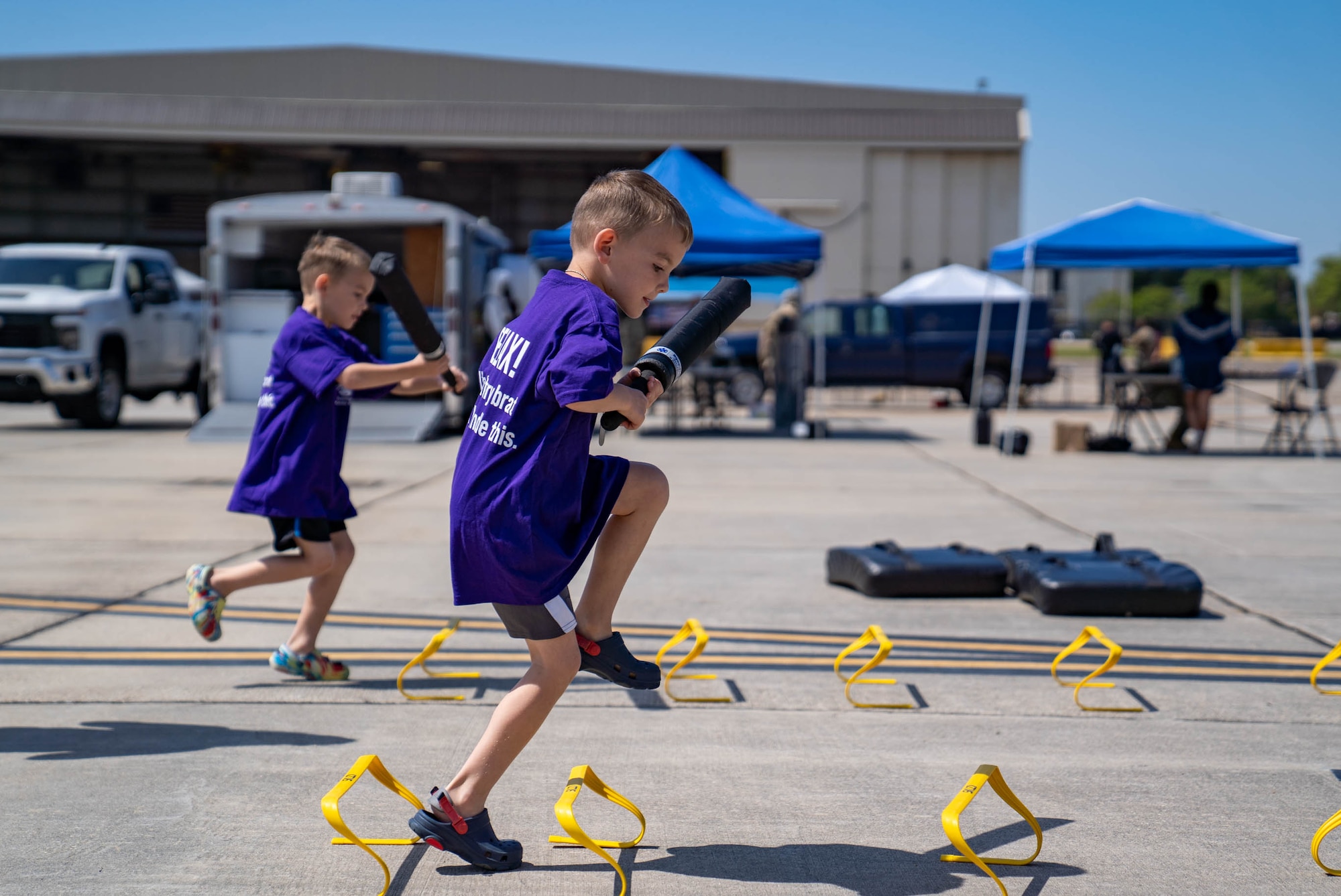 Military children complete an obstacle course set up by the Keesler Marine Detachment at Operation HERO at Keesler Air Force Base, Mississippi, April 6, 2024.
