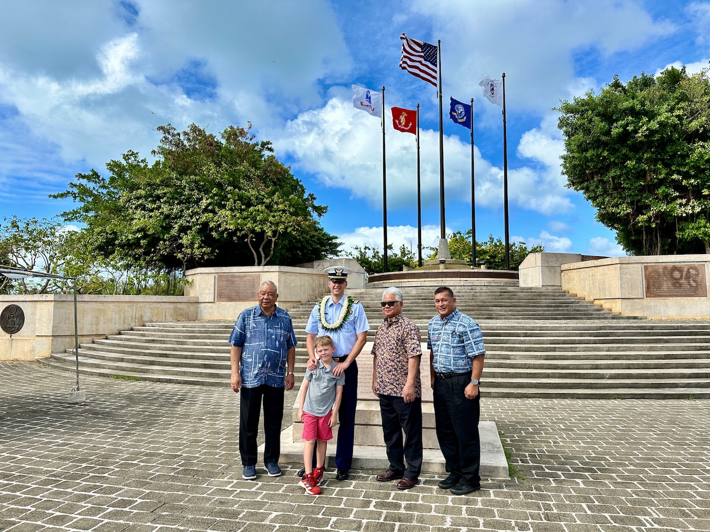 Lt. Justin Miller, commanding officer of Marine Safety Unit Saipan, and his son stand for a photo with CNMI Gov. Arnold Palacios, Lt. Gov. David Apatang, and Harry Blanco, OIA Representative to the CNMI, at a ceremony to formally establish MSU Saipan in Garapan at the American Memorial Park on April 5, 2024. This significant achievement marks a milestone in leadership evolution and responsibility expansion within the U.S. Coast Guard, reflecting steadfast commitment to serving the people of Saipan and the Commonwealth of the Northern Marianas Islands (CNMI) with unparalleled dedication and excellence. The change is part of an initiative to provide junior officers with increased command opportunities, fostering professional growth and leadership development within the ranks. Eighteen marine safety detachments are converting to marine safety units. (U.S. Coast Guard photo by Chief Warrant Officer Sara Muir)