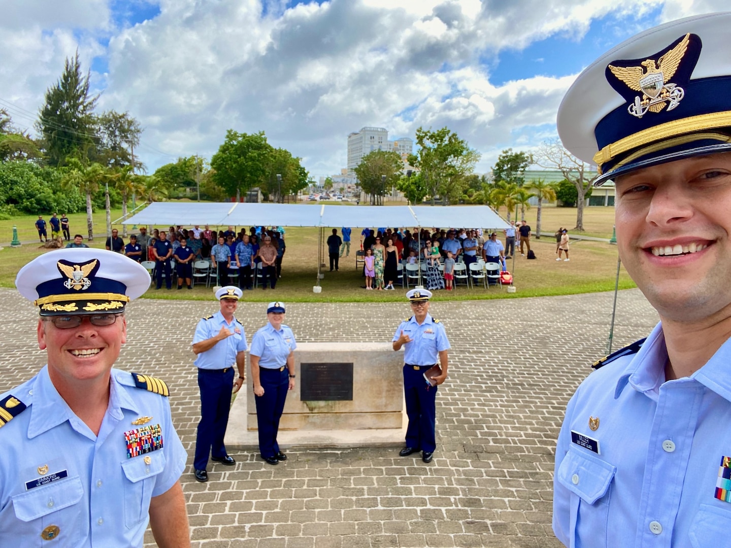 Lt. Justin Miller, commanding officer of Marine Safety Unit Saipan, takes a selfie with assembled guests at a ceremony to formally establish MSU Saipan in Garapan at the American Memorial Park on April 5, 2024. This significant achievement marks a milestone in leadership evolution and responsibility expansion within the U.S. Coast Guard, reflecting steadfast commitment to serving the people of Saipan and the Commonwealth of the Northern Marianas Islands (CNMI) with unparalleled dedication and excellence. The change is part of an initiative to provide junior officers with increased command opportunities, fostering professional growth and leadership development within the ranks. Eighteen marine safety detachments are converting to marine safety units. (U.S. Coast Guard photo by Lt. Justin Miller)