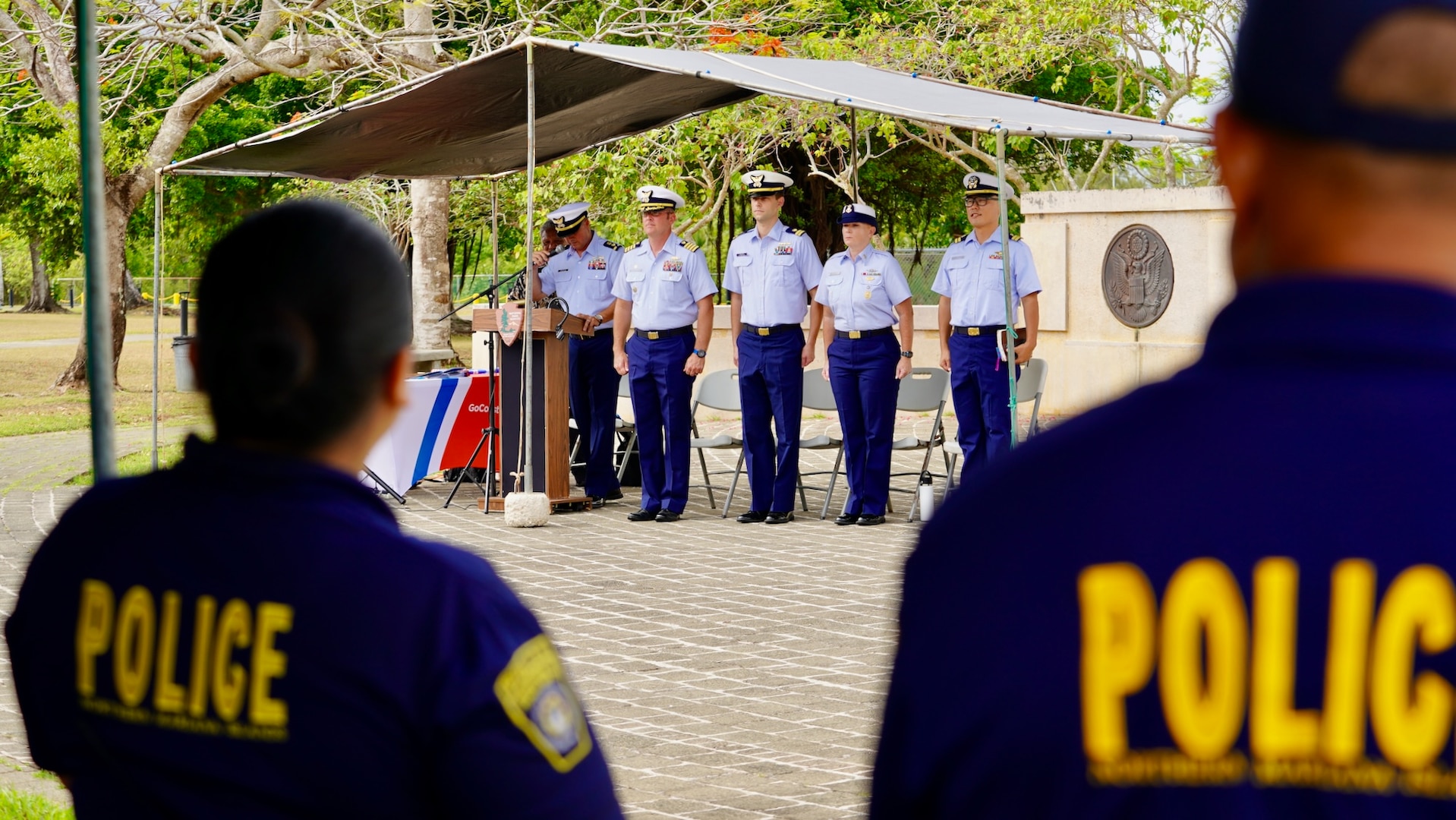 The official party stands for the national anthem at a ceremony to formally establish MSU Saipan in Garapan at the American Memorial Park on April 5, 2024. This significant achievement marks a milestone in leadership evolution and responsibility expansion within the U.S. Coast Guard, reflecting steadfast commitment to serving the people of Saipan and the Commonwealth of the Northern Marianas Islands (CNMI) with unparalleled dedication and excellence. The change is part of an initiative to provide junior officers with increased command opportunities, fostering professional growth and leadership development within the ranks. Eighteen marine safety detachments are converting to marine safety units. (U.S. Coast Guard photo by Chief Warrant Officer Sara Muir)