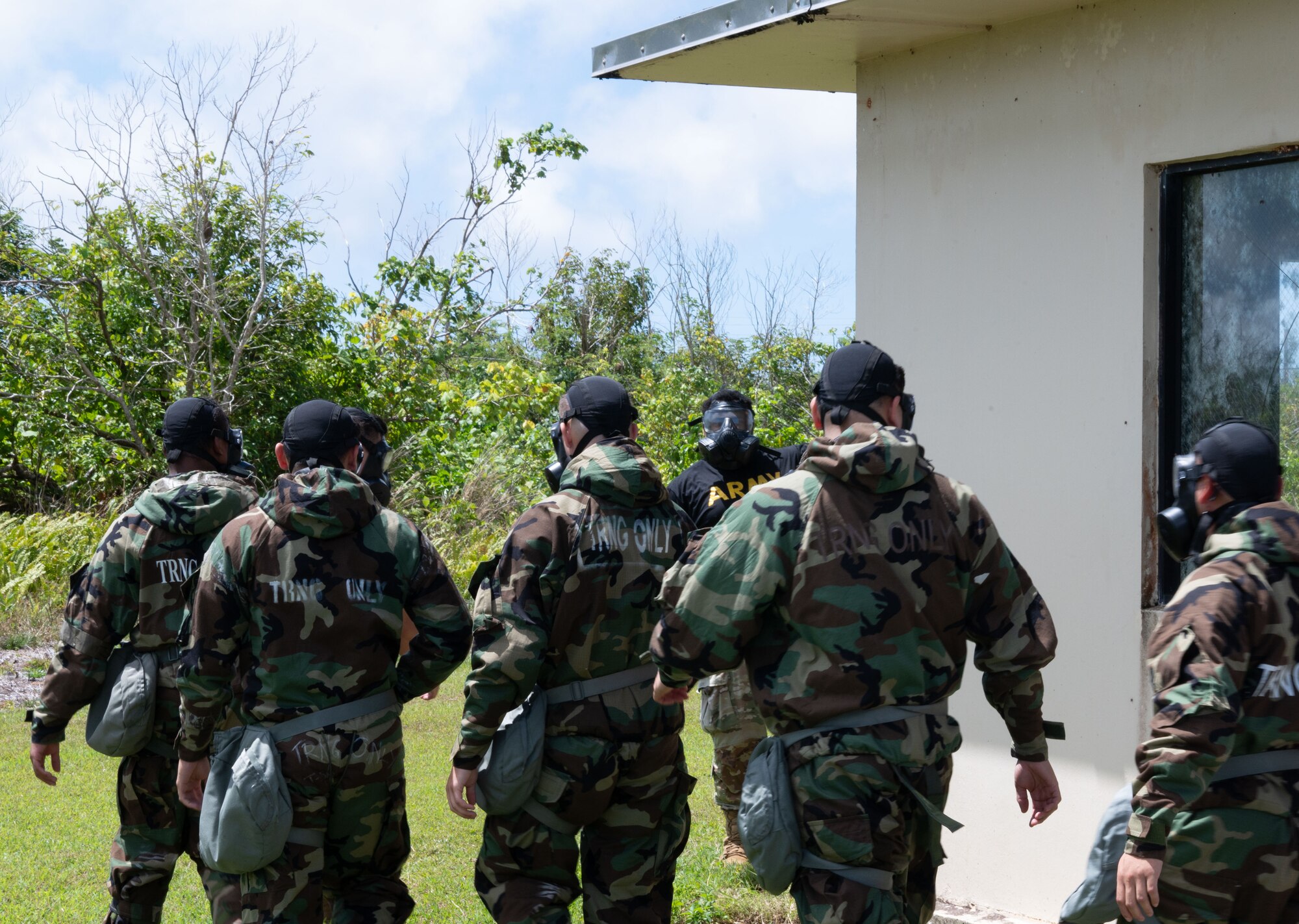 U.S. Military members from U.S. Air Force, U.S. Army, and U.S. Marine Corps work together to create a joint Chemical, Biological, Radiological, and Nuclear (CBRN) training class to enhance interoperability between branches in a hostile environment at Andersen Air Force Base, Guam, Mar. 27, 2024.  Service members learn how to properly wear the hazardous material suits and gas masks while learning how to better communicate in a joint environment.
