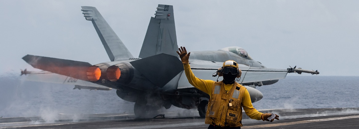 240408-N-YG401-1021 PHILIPPINE SEA (April 8, 2024) U.S. Navy Aviation Boatswain’s Mate 1st Class Michael Joseph, from Carrollton, Ga., signals aircraft as an F/A-18E Super Hornet, assigned to the “Flying Checkmates” of Strike Fighter Squadron (VFA) 211, takes off from the flight deck aboard the Nimitz-class aircraft carrier USS Theodore Roosevelt (CVN 71), April 8, 2024. Theodore Roosevelt, flagship of Carrier Strike Group Nine, is underway conducting routine operations in the U.S. 7th Fleet area of operations. U.S. 7th Fleet is the U.S. Navy’s largest forward-deployed numbered fleet, and routinely interacts and operates with allies and partners in preserving a free and open Indo-Pacific region. (U.S. Navy photo by Mass Communication Specialist 2nd Class Andrew Benvie)