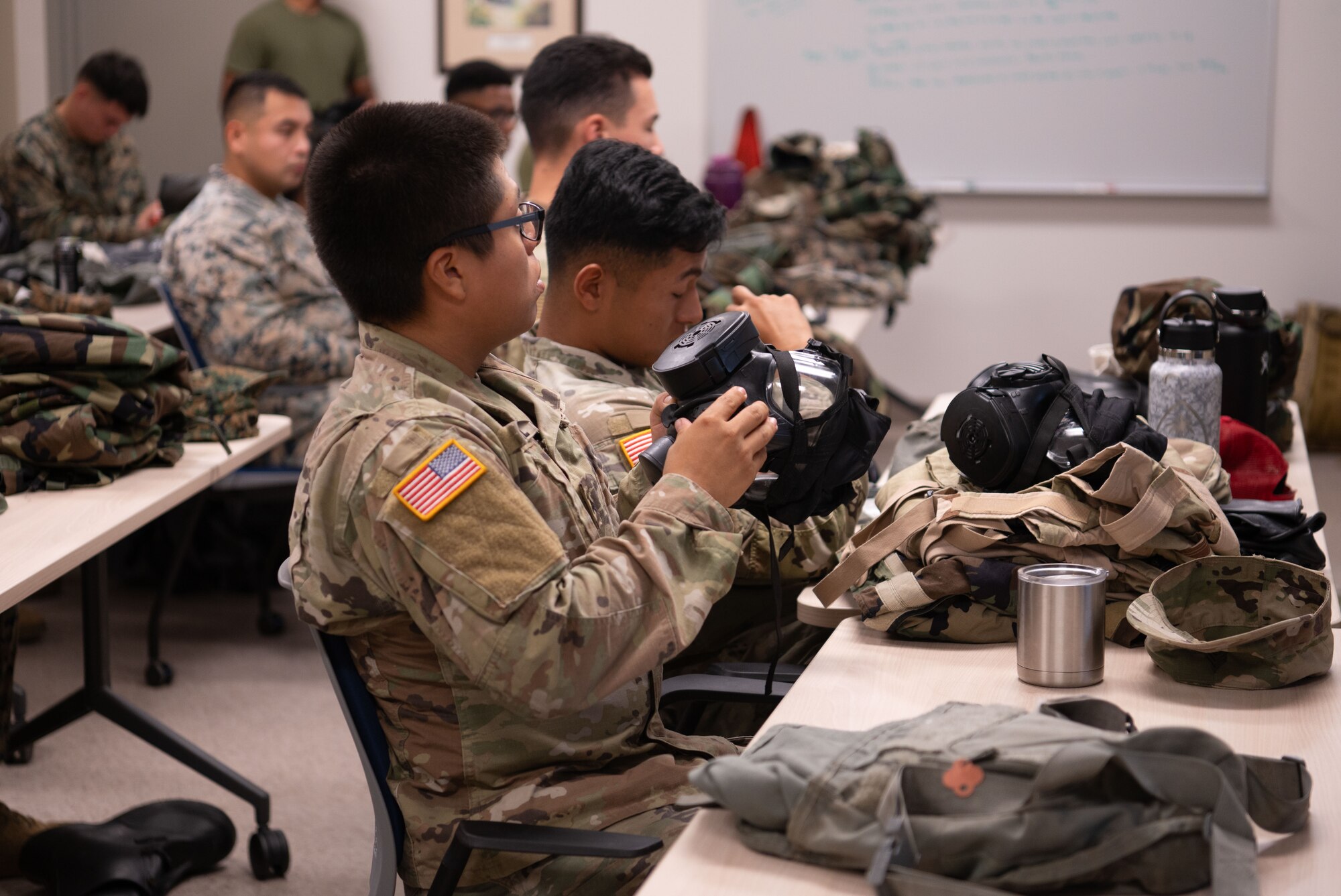 U.S. Military members from U.S. Air Force, U.S. Army, and U.S. Marine Corps work together to create a joint Chemical, Biological, Radiological, and Nuclear (CBRN) training class to enhance interoperability between branches in a hostile environment at Andersen Air Force Base, Guam, Mar. 27, 2024.  Service members learn how to properly wear the hazardous material suits and gas masks while learning how to better communicate in a joint environment.