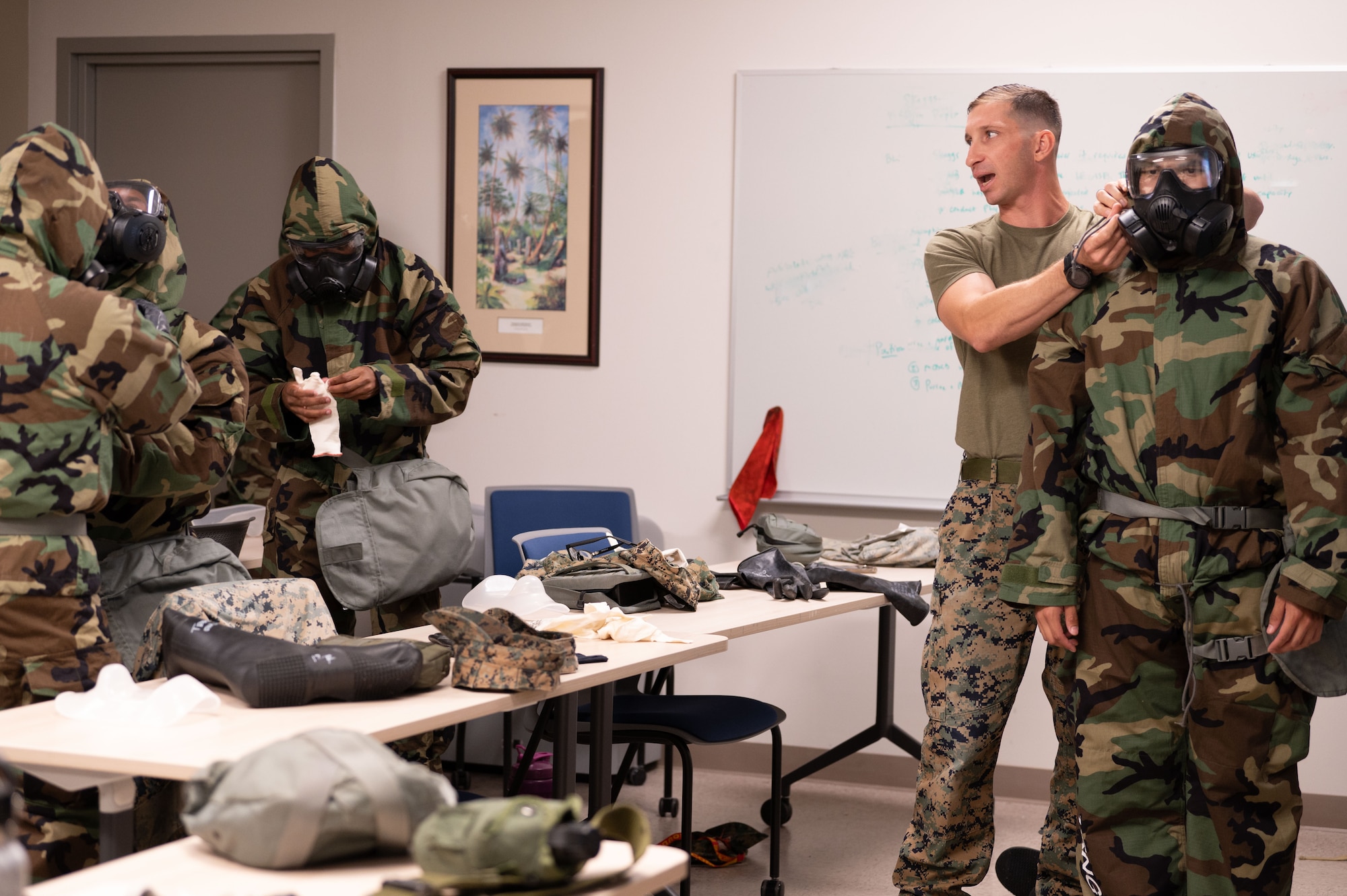 U.S. Military members from U.S. Air Force, U.S. Army, and U.S. Marine Corps work together to create a joint Chemical, Biological, Radiological, and Nuclear (CBRN) training class to enhance interoperability between branches in a hostile environment at Andersen Air Force Base, Guam, Mar. 27, 2024.  Service members learn how to properly wear the hazardous material suits and gas masks while learning how to better communicate in a joint environment.