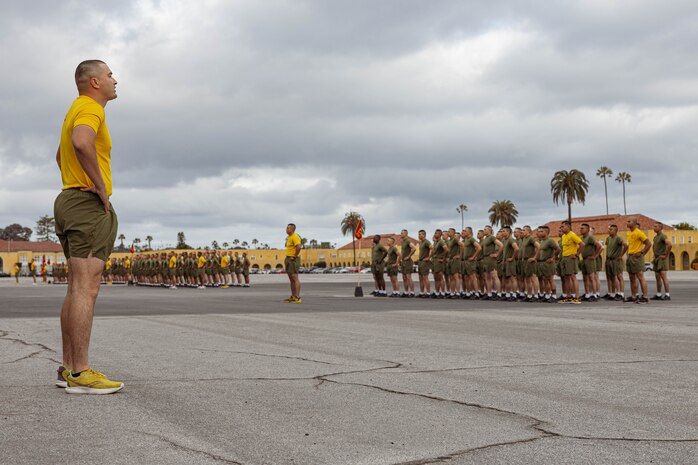 New U.S. Marines with Hotel Company, 2nd Recruit Training Battalion, conduct warm-up exercises before their motivational run at Marine Corps Recruit Depot San Diego, California, April 4, 2024. The motivational run is the last physical training exercise Marines conduct while at MCRDSD. (U.S. Marine Corps photo by Cpl. Sarah M. Grawcock)