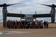 Educators with Recruiting Stations’ Albuquerque, Denver, Houston, and Salt Lake City pose for a group photo in front a MV-22 Osprey as part of the 2024 Educator’s Workshop, April 4, 2024 at Marine Corps Air Station Miramar, California. Participants of the workshop visit MCRD San Diego to observe recruit training and gain a better understanding about the transformation from recruits to United States Marines. Educators also received classes and briefs on the benefits that are provided to service members serving in the United States armed services. (U.S. Marine Corps photo by Sgt. Trey Q. Michael)