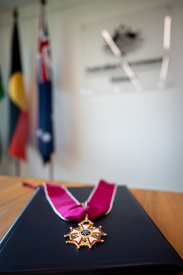 The legion of merit lays on a table before a ceremony where Adm. John C. Aquilino, Commander of U.S. Indo-Pacific Command, will present the award to Gen. Angus Campbell, Australia Chief of the Defence Force, in Canberra, Australia, on April 8, 2024. The Legion of Merit is the highest accolade that the U.S. can bestow upon a foreign leader; it is reserved for individuals who have shown exceptionally meritorious conduct in the performance of outstanding services. USINDOPACOM is committed to enhancing stability in the Indo-Pacific region by promoting security cooperation, encouraging peaceful development, responding to contingencies, deterring aggression and, when necessary, fighting to win. (U.S. Navy photo by Chief Mass Communication Specialist Shannon M. Smith)