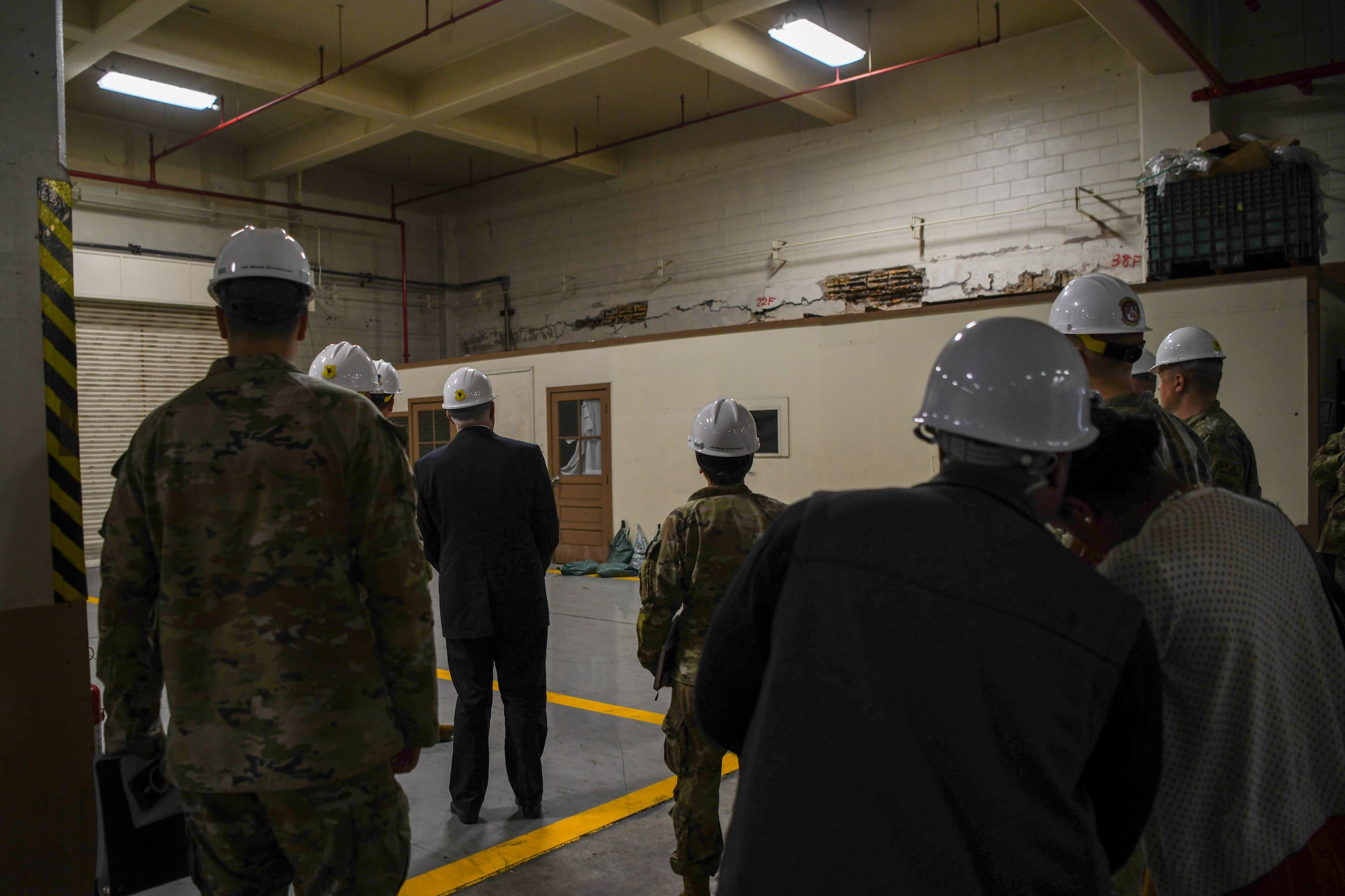 SecAF inspects a damaged facility.
