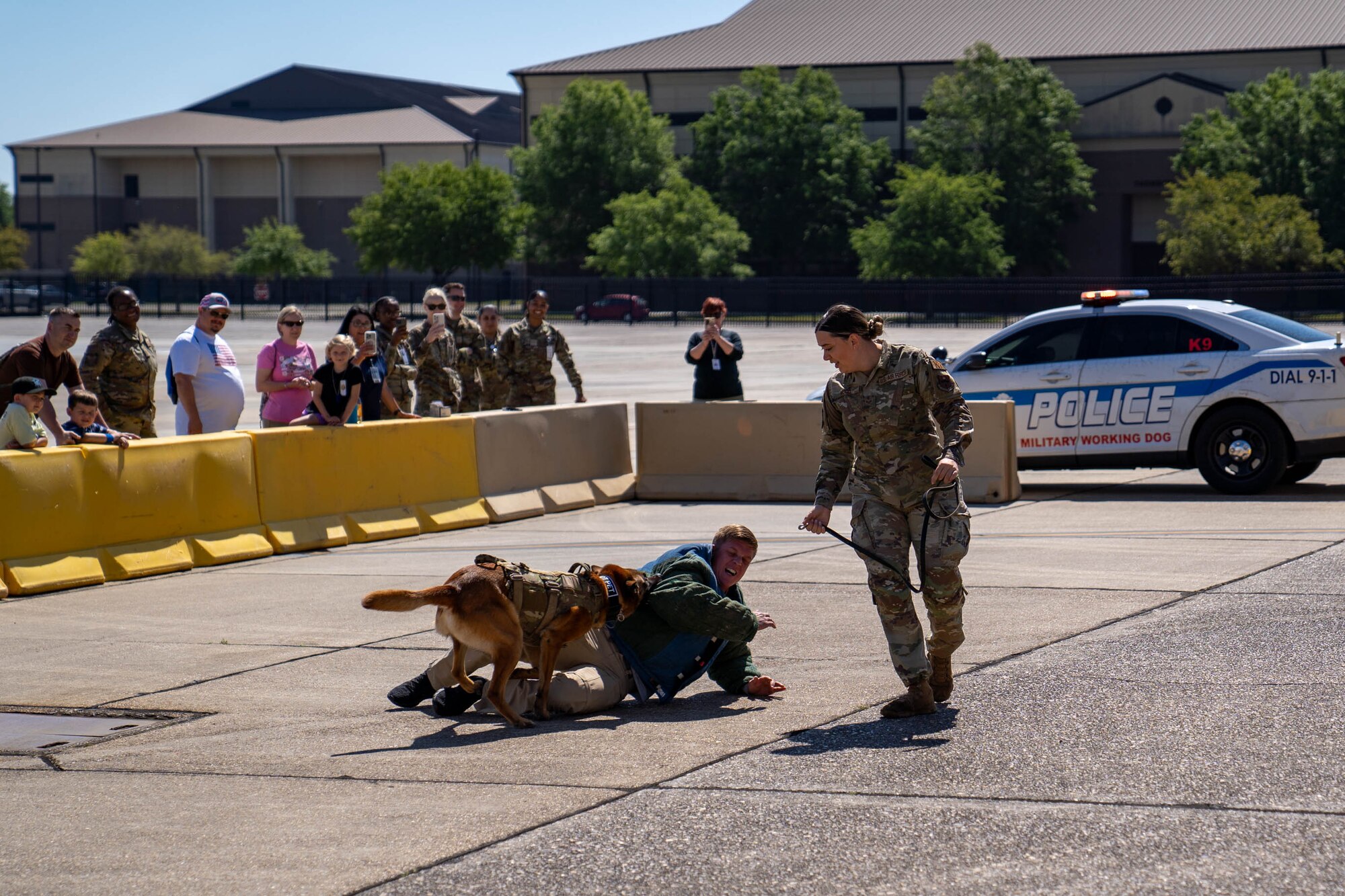 U.S. Air Force Staff Sgt. Ryan Wood, 81st Security Forces Squadron military working dog hander, works with MWD Victor for a demonstration at Operation HERO at Keesler Air Force Base, Mississippi, April 6, 2024.