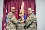 U.S. Air Force Col. Ronald Selvidge assumes command of the 380th Air Expeditionary Wing from Brig. Gen. Terence Taylor, outgoing commander of the 380th AEW, during a change of command and change of responsibility ceremony at an undisclosed location within the U.S. Central Command area of responsibility, April 1, 2024.