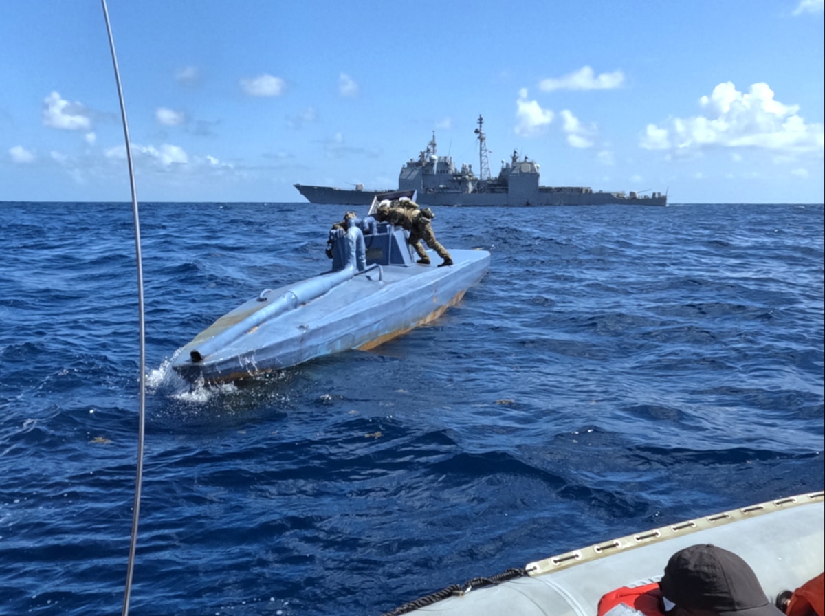 The Ticonderoga-class guided missile cruiser USS Leyte Gulf (CG 55), embarked U.S. Coast Guard Law Enforcement Detachment (LEDET) and Helicopter Maritime Strike Squadron (HSM) 50 work together to intercept a self-propelled semi-submersible drug smuggling vessel (SPSS), in the Atlantic Ocean, March 22, 2024. Leyte Gulf is on a scheduled deployment in the U.S. Naval Forces Southern Command area of operations, employed by U.S. Fourth Fleet to support joint and combined military operations, which includes counter-illicit drug trafficking missions in the Caribbean and the Atlantic.