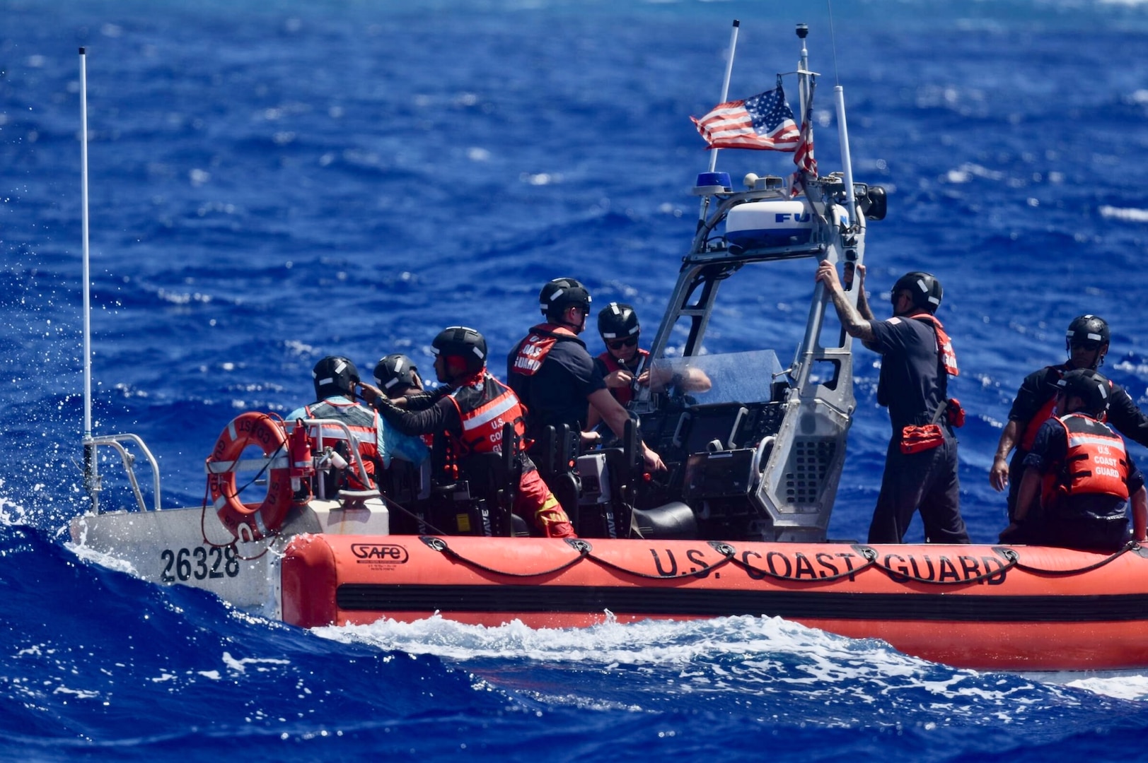 The crew of USCGC Oliver Henry (WPC 1140), having rescued three mariners stranded on Pikelot Atoll, Yap State, Federated States of Micronesia, prepare the cutter boat and the marienrs to be recovered to the cutter for further transport to Polowat Atoll, Chuuk State, on April 9, 2024. Watchstanders at Joint Rescue Sub-Center Guam received a distress call from a relative of the three mariners on April 6, 2024, reporting her three uncles departed Polowat Atoll Easter Sunday for Pikelot Atoll, approximately 100 nautical miles northwest and had not returned, prompting the search. (U.S. Coast Guard photo)