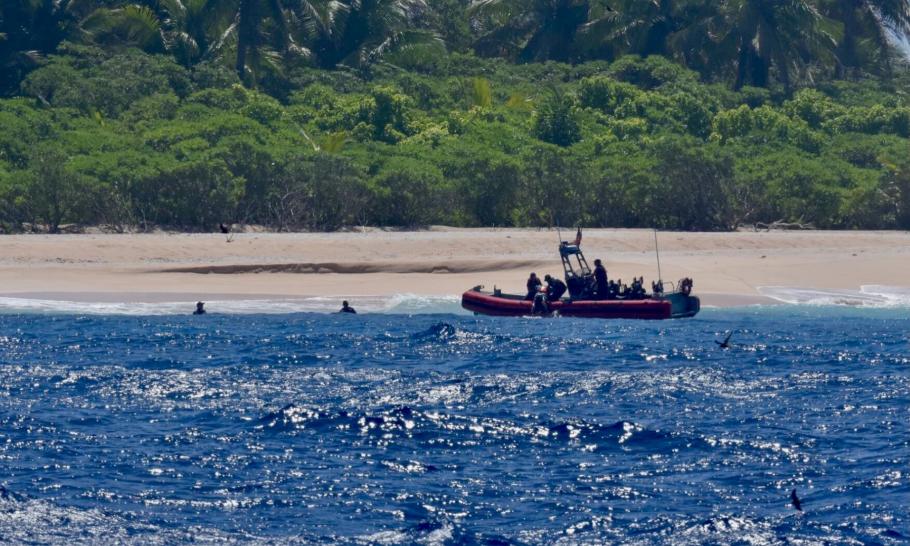 The crew of USCGC Oliver Henry (WPC 1140) rescues three mariners stranded on Pikelot Atoll, Yap State, Federated States of Micronesia, on April 9, 2024. Watchstanders at Joint Rescue Sub-Center Guam received a distress call from a relative of the three mariners on April 6, 2024, reporting her three uncles departed Polowat Atoll, Chuuk State, Easter Sunday for Pikelot Atoll, approximately 100 nautical miles northwest and had not returned, prompting the search. (U.S. Coast Guard photo)