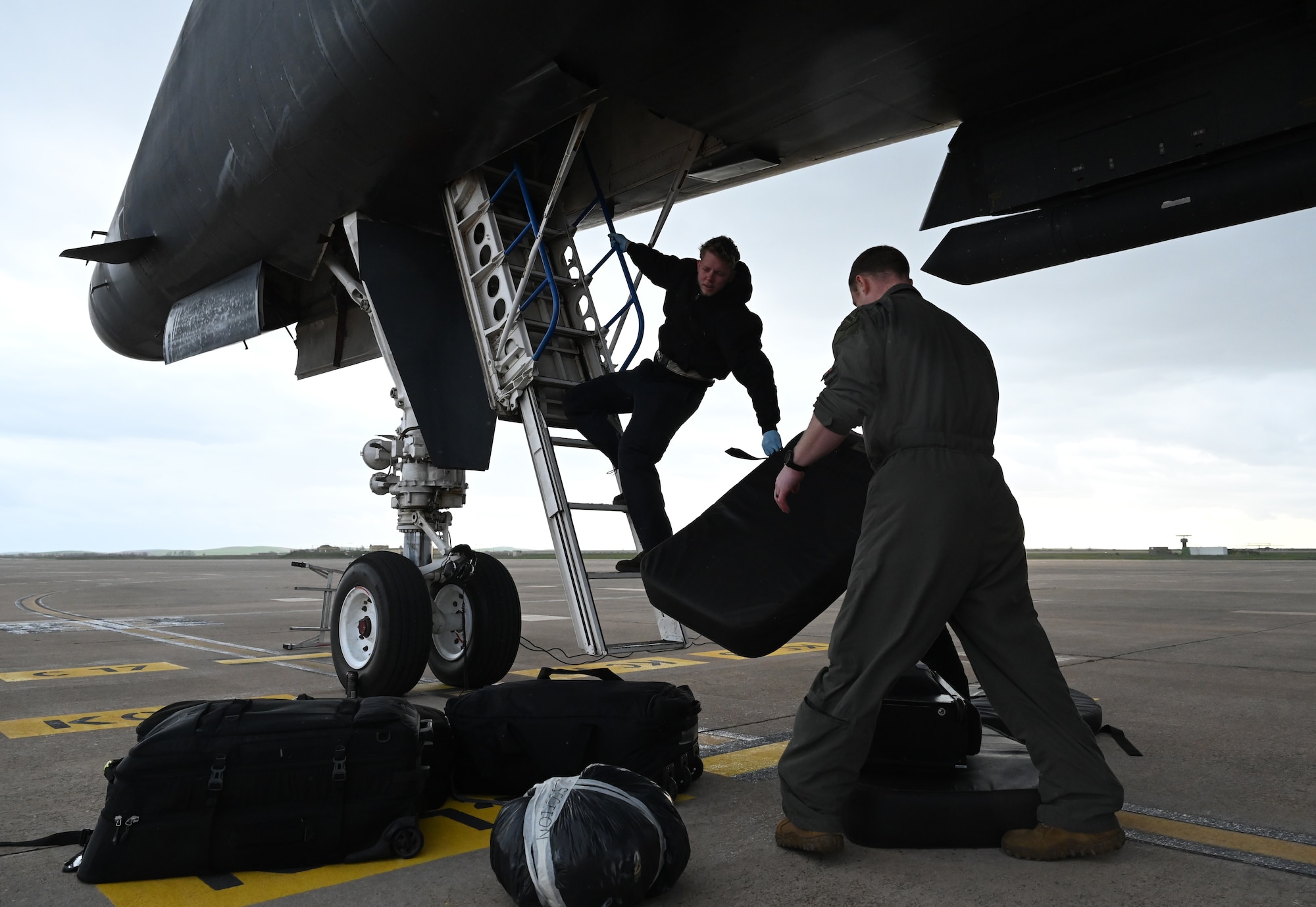 Members of the 9th Expeditionary Bomb Squadron unload cargo from a B-1B Lancer at Morón Air Base, Spain, during Bomber Task Force 24-2, March 26, 2024. The operational readiness of U.S. forces across all domains is critical to building partnerships, responding to crises, providing deterrence, and supporting Allies and partners. (U.S. Air Force photo by Staff Sgt. Holly Cook)