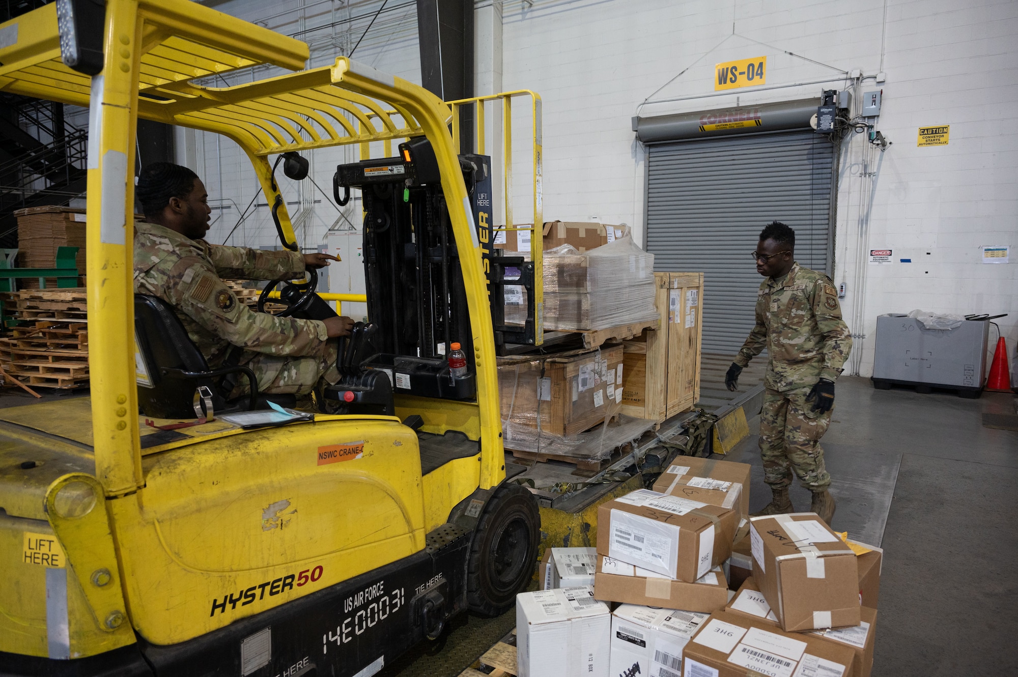 U.S. Air Force Airman Nelson Fabius, left, 436th Aerial Port Squadron cargo processing specialist, and Airman 1st Class Kossivi Ayedji, right, 436th Aerial Port Squadron cargo processing specialist, loads a pallet at Dover Air Force Base, Delaware, April 4, 2024. The 436th APS, known as Dover AFB’s “Super Port,” has played a pivotal role in the base’s ongoing mission of rapid global mobility. (U.S. Air Force photo by Airman 1st Class Dieondiere Jefferies)