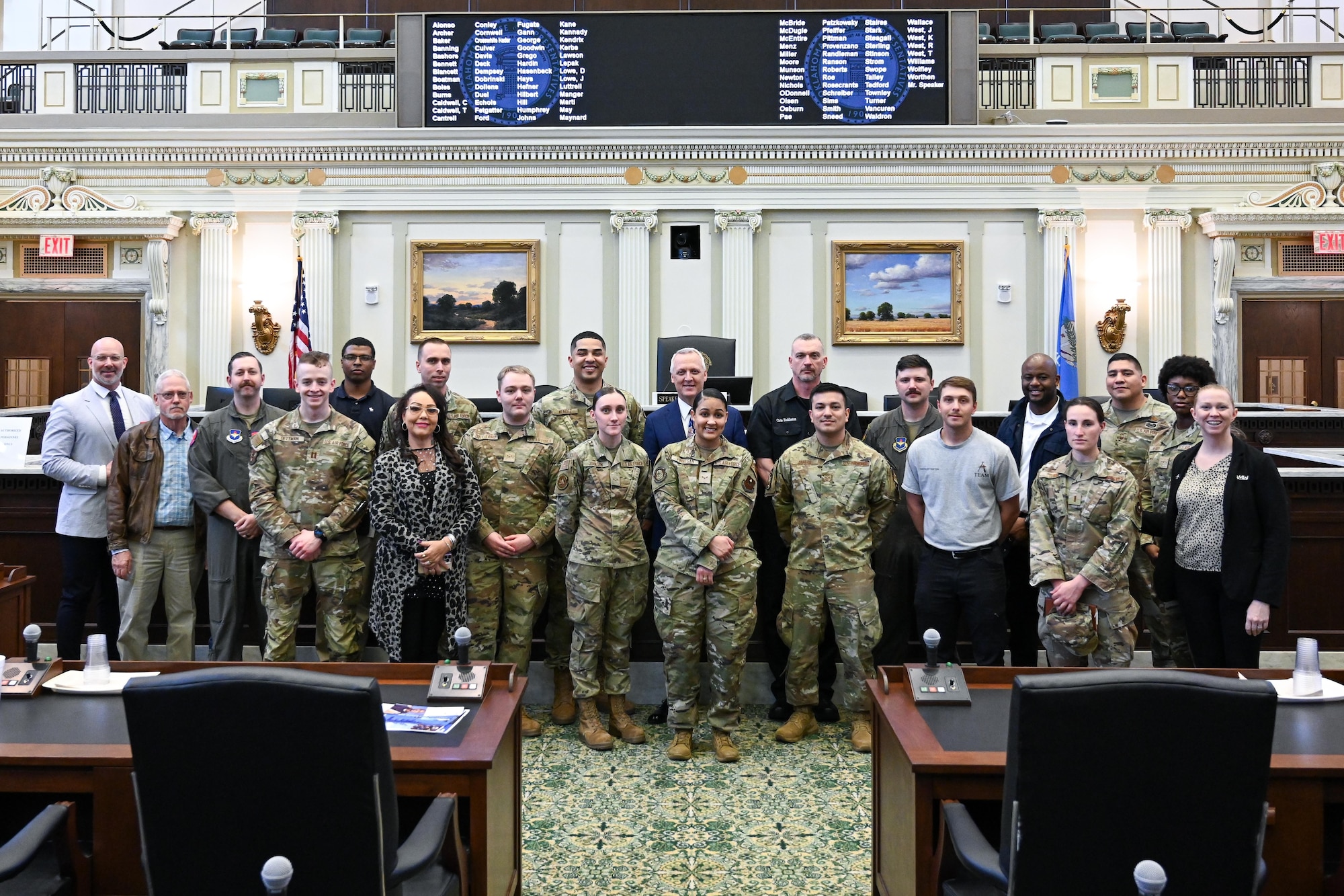 Airmen from Altus Air Force Base, Oklahoma, pose for a photo with Representative Gerrid Kendrix at the Oklahoma State Capitol, April 3, 2024. Rep. Kendrix showed airmen the representative’s meeting room and they sat in on a legislative session. (U.S. Air Force photo by Airman 1st Class Jonah G. Bliss)