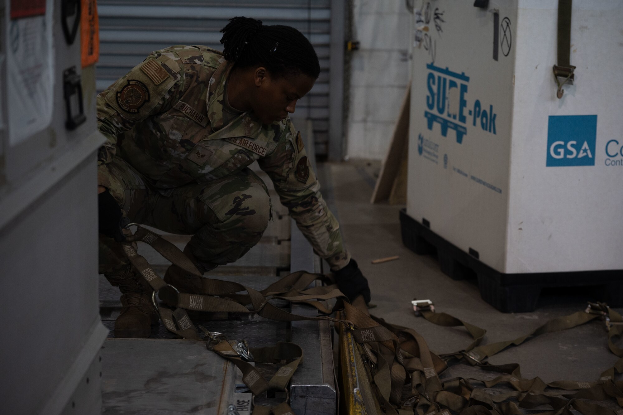 U.S. Air Force Senior Airman SidneyAnn Buchanan, 436th Aerial Port Squadron, air transportation journeyman, secures a pallet strap at Dover Air Force Base, Delaware, April 4, 2024. The 436th APS, known as Dover AFB’s “Super Port,” has played a pivotal role in the base’s ongoing mission of rapid global mobility. (U.S. Air Force photo by Airman 1st Class Dieondiere Jefferies)