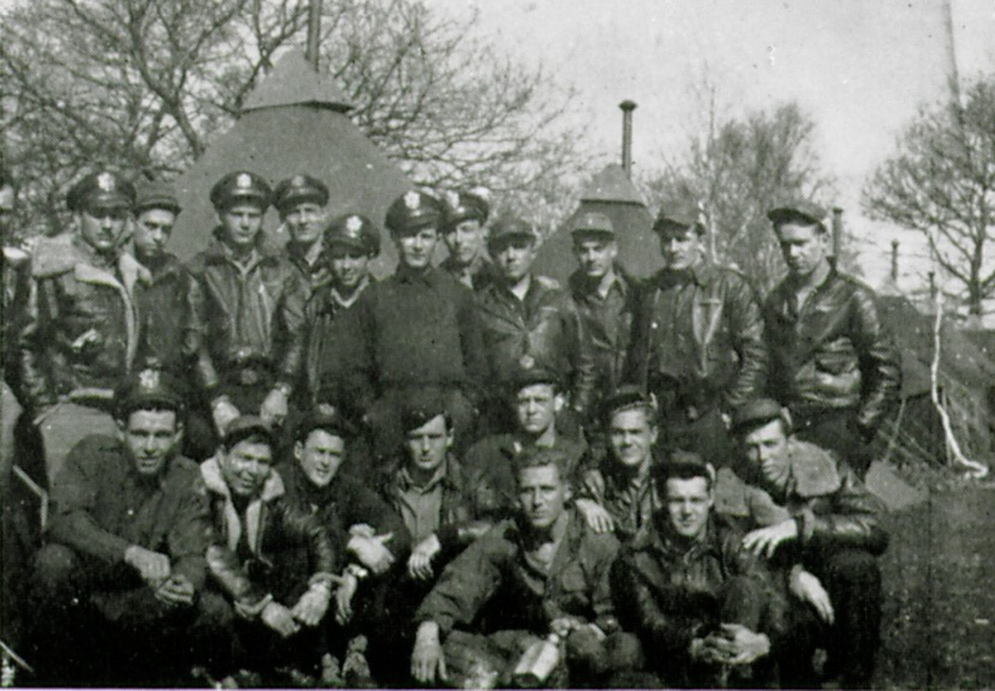 Lt. Joseph E. Larochelle is pictured here kneeling in the front row, second from the left in this picture of the initial cadre of the 371st Fighter Group’s 404th Fighter Squadron.  He became the group’s first pilot to be taken captive on D-Day, June 6, 1944, and was one of six pilots from his squadron whop became POWs in the war.  (The Story of the 371st Fighter Group in the E.T.O.)