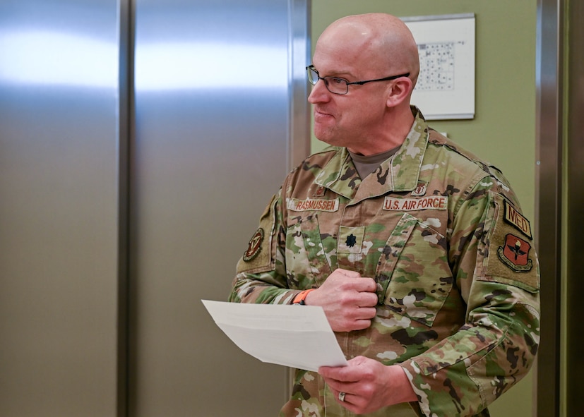 Lt. Col. Kevin Rasmussen, 59th Medical Specialty Squadron commander, expresses pride as Col. Wendi Wohltmann, 59th Medical Specialty Squadron dermatopathologist and dermatologist, is presented with the Military Health System 2023 Award for the Advancement of Women Physicians in Military Medicine at Wilford Hall Ambulatory Surgical Center, Joint Base San Antonio-Lackland, Texas, Feb. 7, 2024. The award not only recognizes individual efforts but also serves to inspire and encourage others to continue championing diversity and equality within the military healthcare system. (U.S. Air Force photo by Senior Airman Melody Bordeaux)