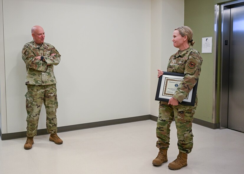 Maj. Gen. Thomas Harrell, 59th Medical Wing commander, expresses his pride and enthusiasm for Col. Wendi Wohltmann, 59th Medical Specialty Squadron dermatopathologist and dermatologist, after presenting her the Military Health System 2023 Award for the Advancement of Women Physicians in Military Medicine at Wilford Hall Ambulatory Surgical Center, Joint Base San Antonio-Lackland, Texas, on Feb. 7, 2024. The award symbolizes the commitment of the military medical community to fostering an inclusive environment where all healthcare professionals, regardless of gender, can thrive and contribute effectively to the mission of providing high-quality medical care to service members and their families. (U.S. Air Force photo by Senior Airman Melody Bordeaux)