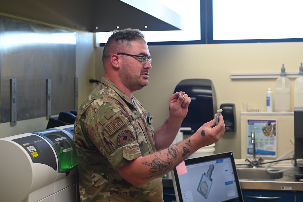 U.S. Air Force Staff Sgt. Coty Will, 17th Medical Group Dental Laboratory noncommissioned officer in charge, discusses the different types of dental crowns at the Ross Clinic at Goodfellow Air Force Base, Texas, April 5, 2024. Will showcased the technology available to the dental facilities at the Ross Clinic to the 17th Training Wing honorary commanders. (U.S. Air Force photo by Airman 1st Class Brian Lummus)
