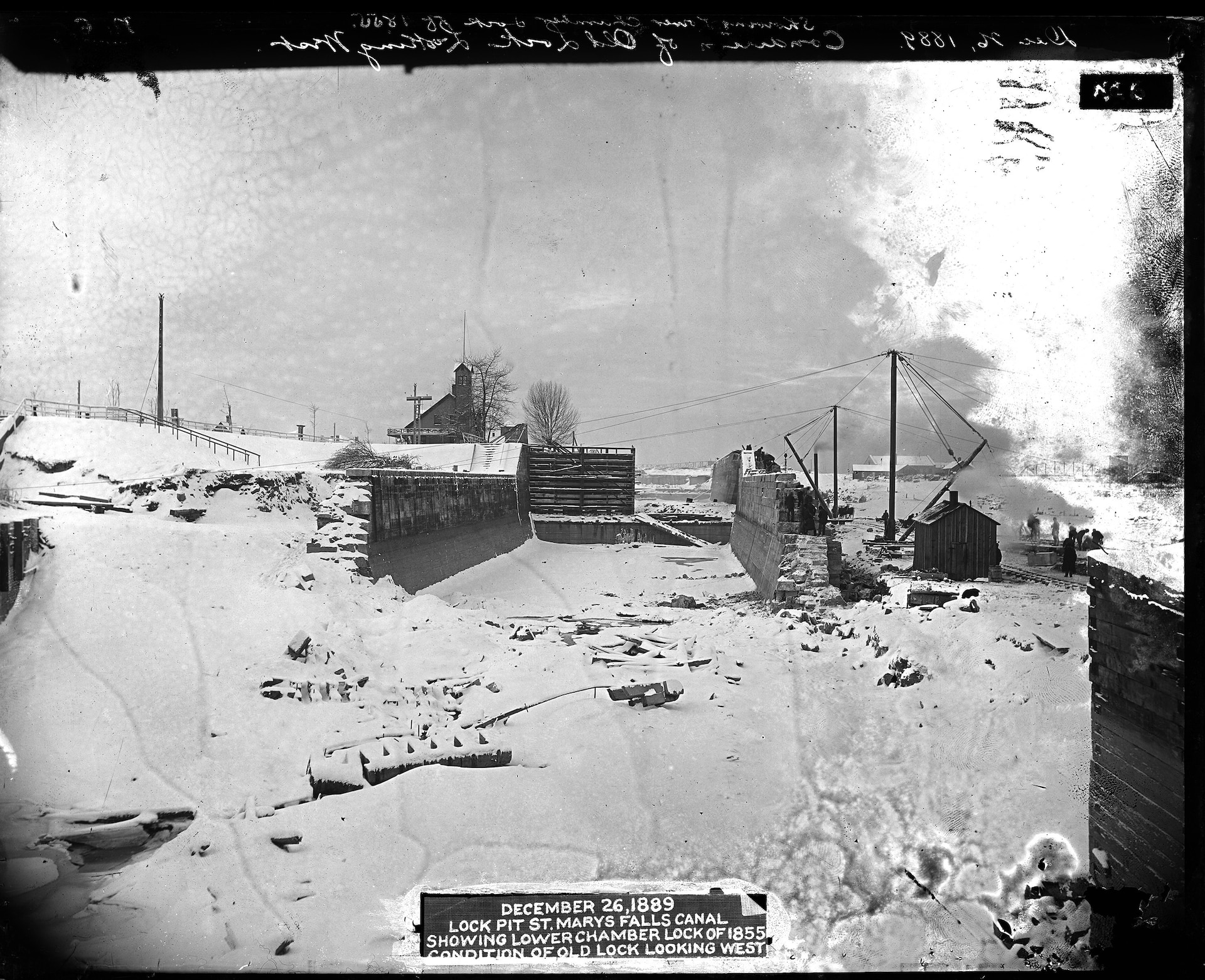 December 26, 1889 Lock pit St. Marys Falls Canal showing lower chamber lock of 1855 condition of old lock looking west.